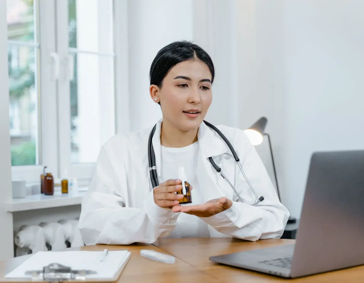 A doctor sitting with a patient, taking her through the plan