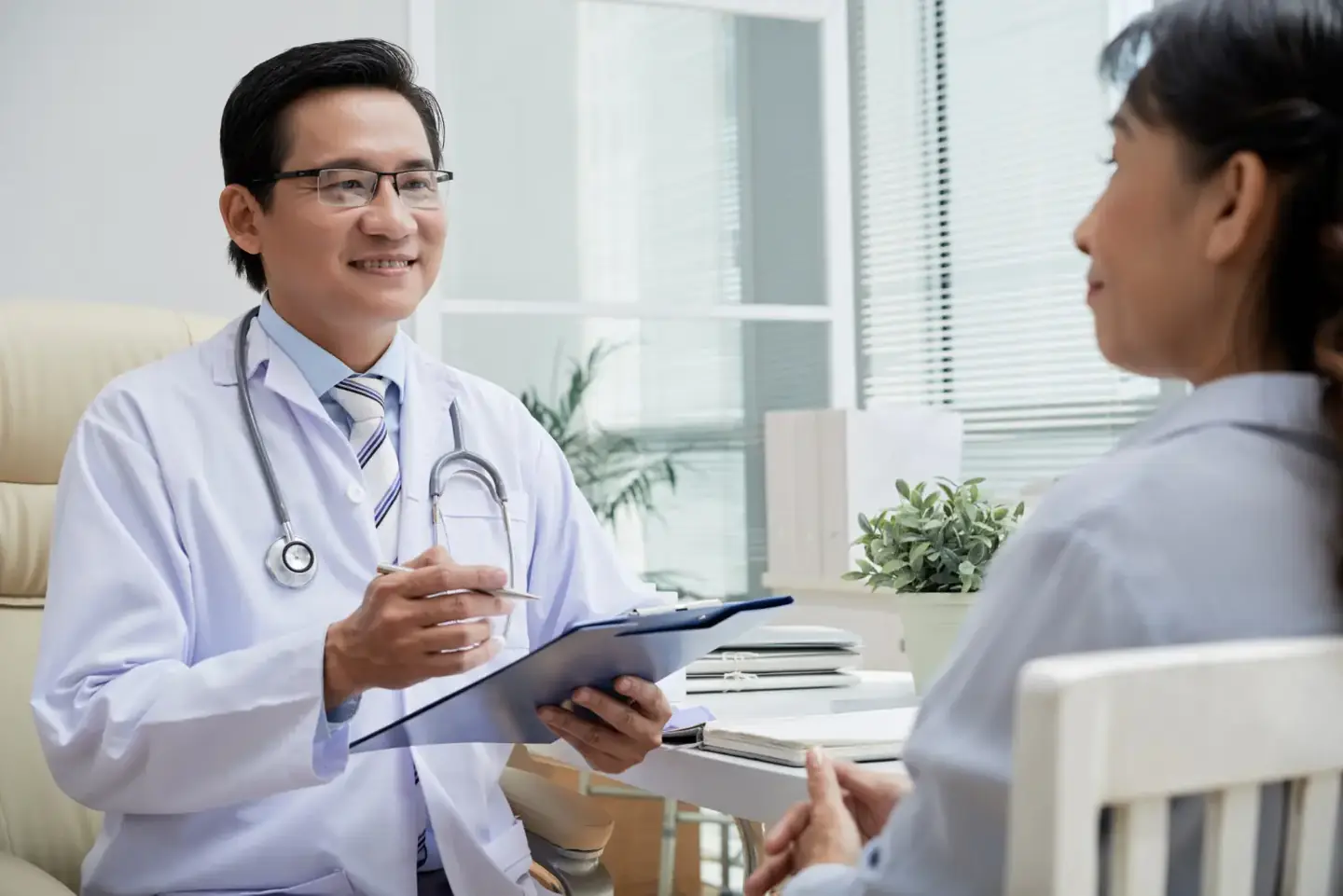 Doctor talking through a patient’s results during a consultation